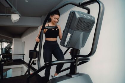 Club cardio deck where commercial stair climbers compete for floor space