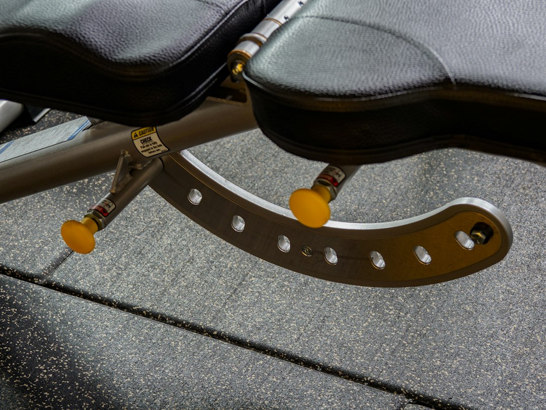Pad and frame junction on a commercial weight bench