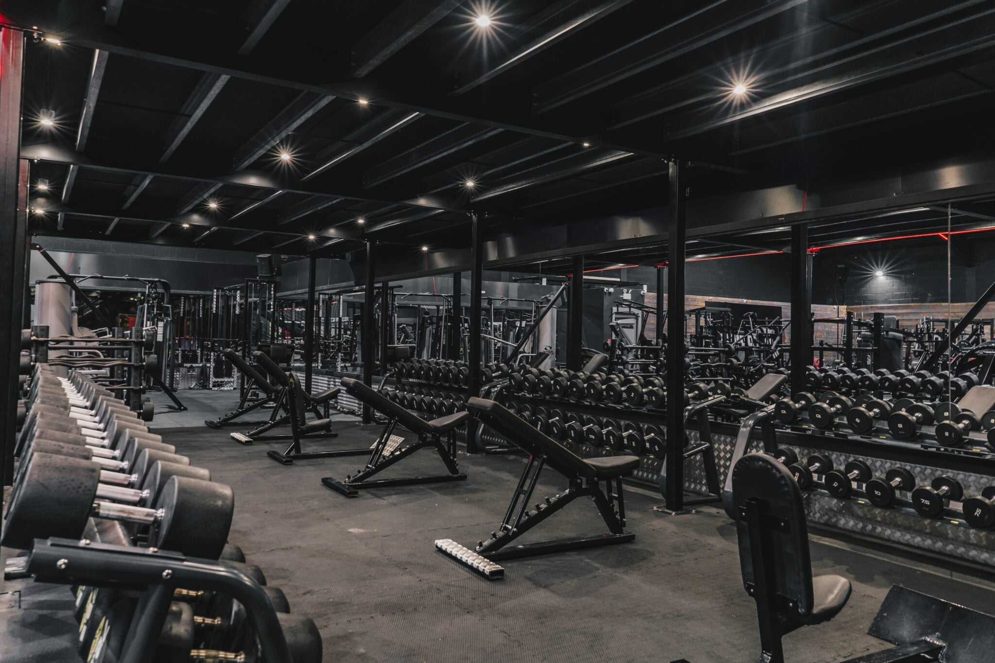 Club floor of machines staged for gym equipment relocation