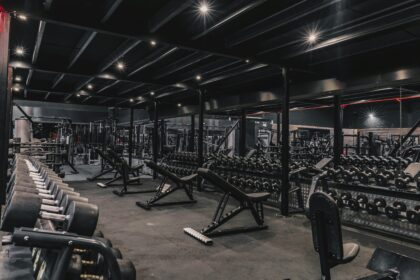 Club floor of machines staged for gym equipment relocation