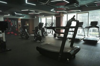 Row of cardio machines on a club floor tracked in an equipment asset register