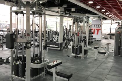 Cable stack machine on a club floor illustrating equipment warranty reserve exposure