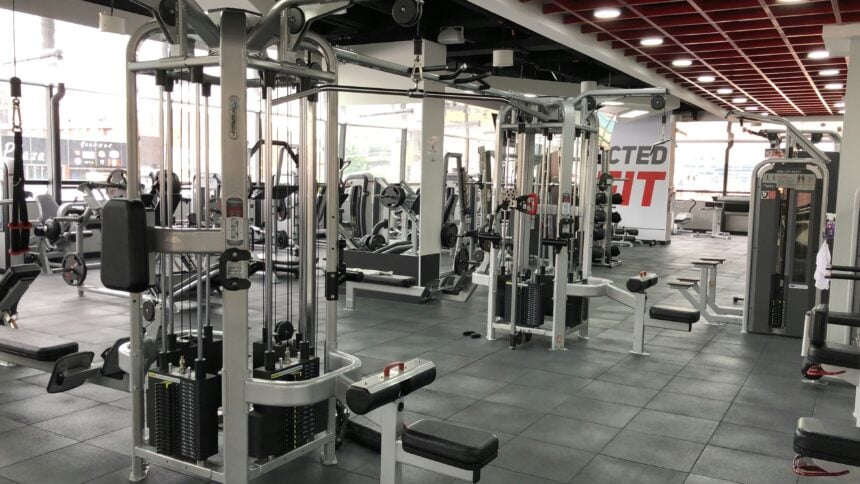 Cable stack machine on a club floor illustrating equipment warranty reserve exposure
