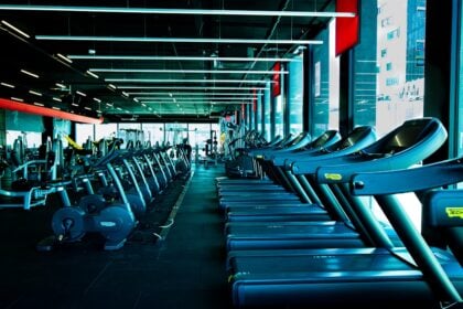 Rows of cardio machines on a club floor where gym equipment liability exposure is created and recorded
