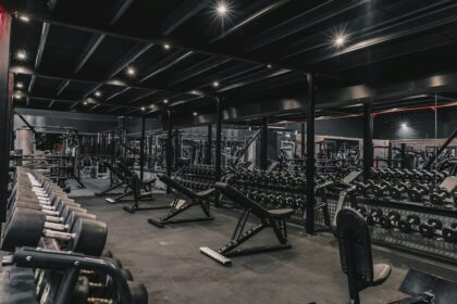 Rows of commercial gym machines on a dealer floor where equipment sales compensation decides the discount