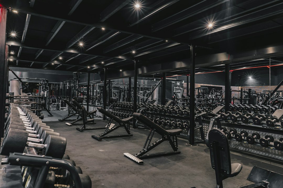 Rows of commercial gym machines on a dealer floor where equipment sales compensation decides the discount