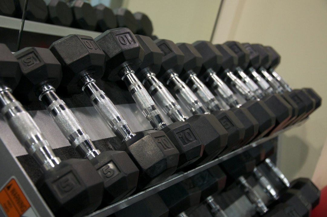 Dumbbell cradles where equipment powder coating wears through first
