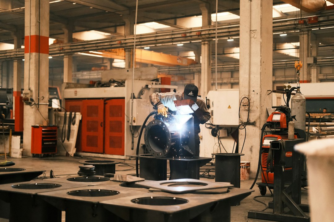Welder joining steel tube on a line producing private label fitness equipment frames