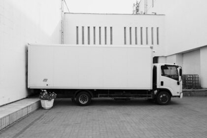 Delivery truck at a dock, the shipping question a manufacturer rep agreement has to settle