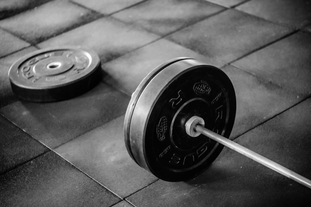 A loaded bar showing why urethane weight plates are specified for drop zones