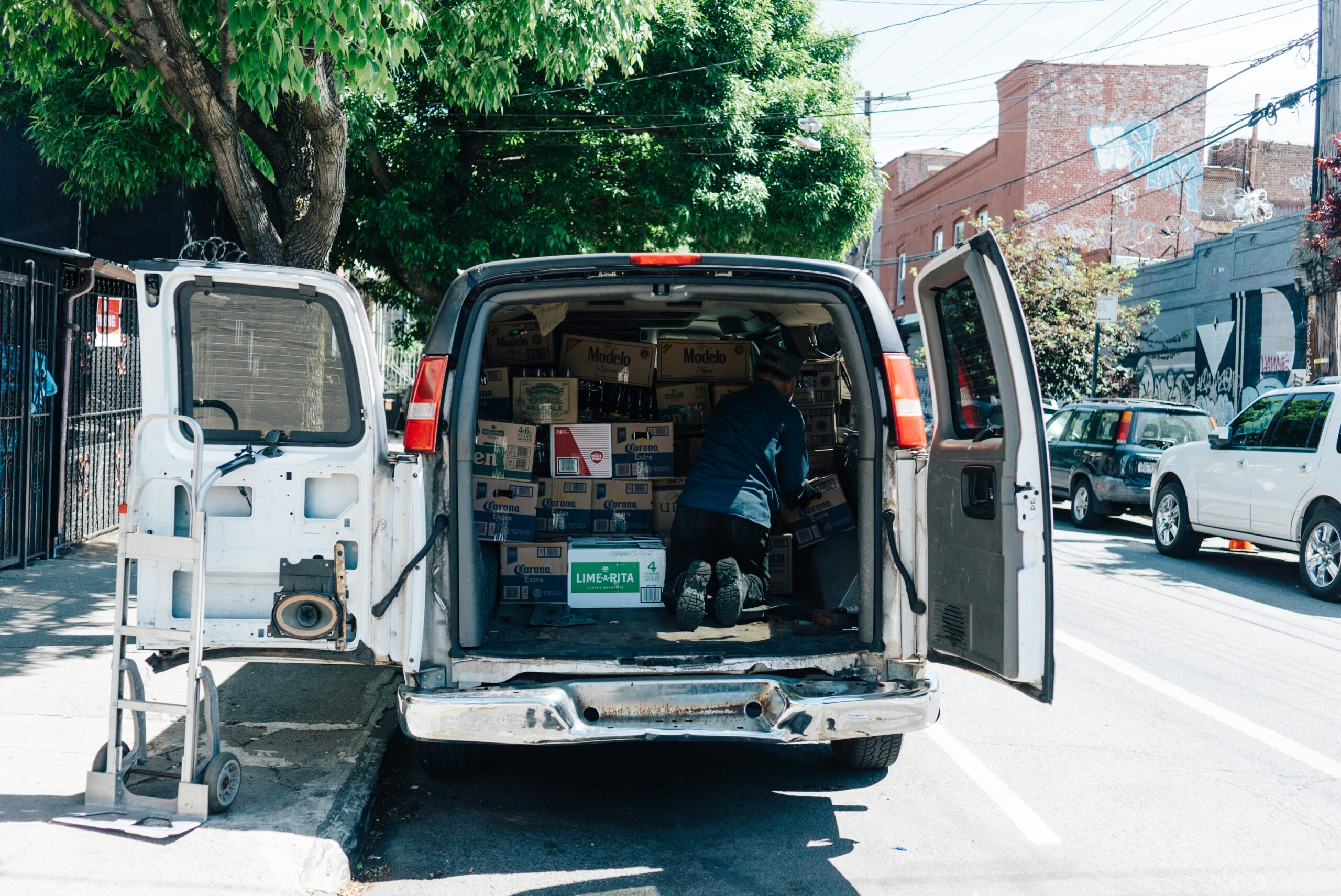 Open cargo van holding mobile personal training equipment for a day of sessions