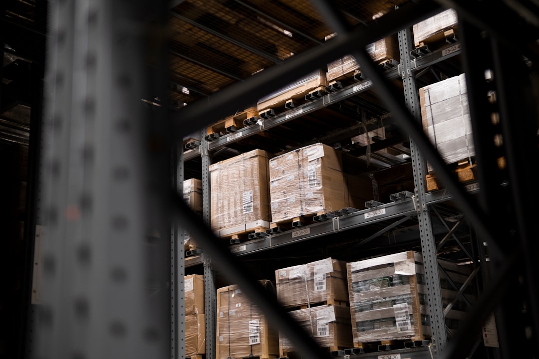 Pallet racking stocked against equipment order seasonality before a peak quarter