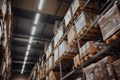Palletized cartons in a distributor warehouse where equipment freight class is determined by density