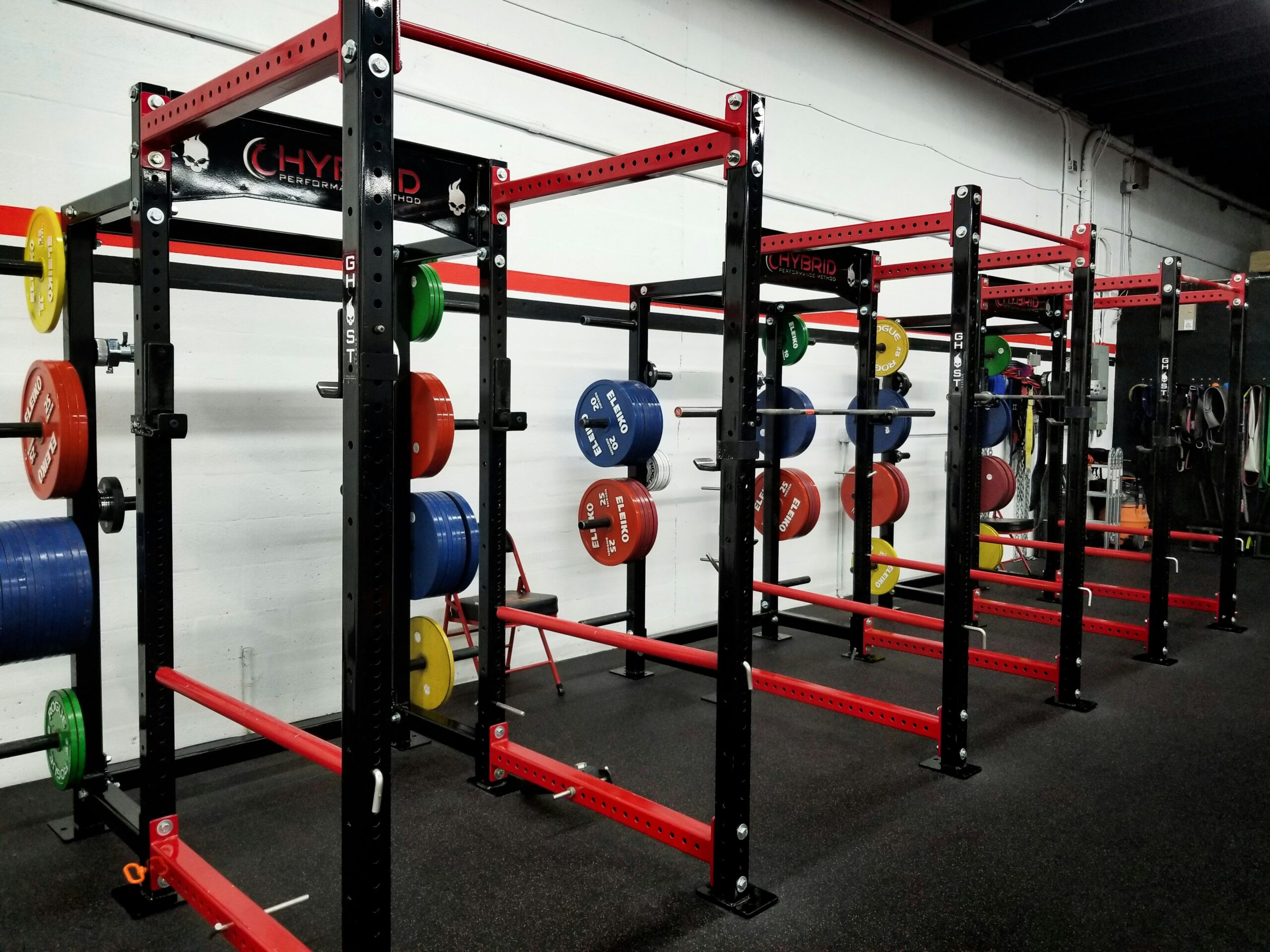 Squat rack row showing the half-rack format new strength equipment brands are entering