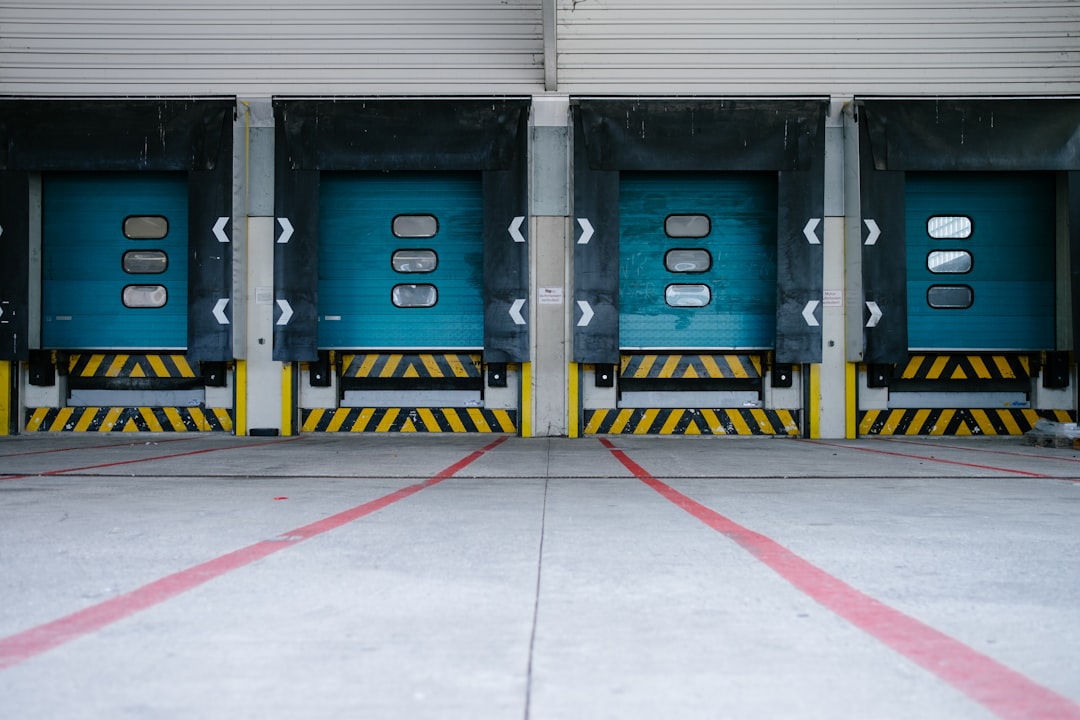 Warehouse dock doors marking the boundary that distributor territory agreements try to draw