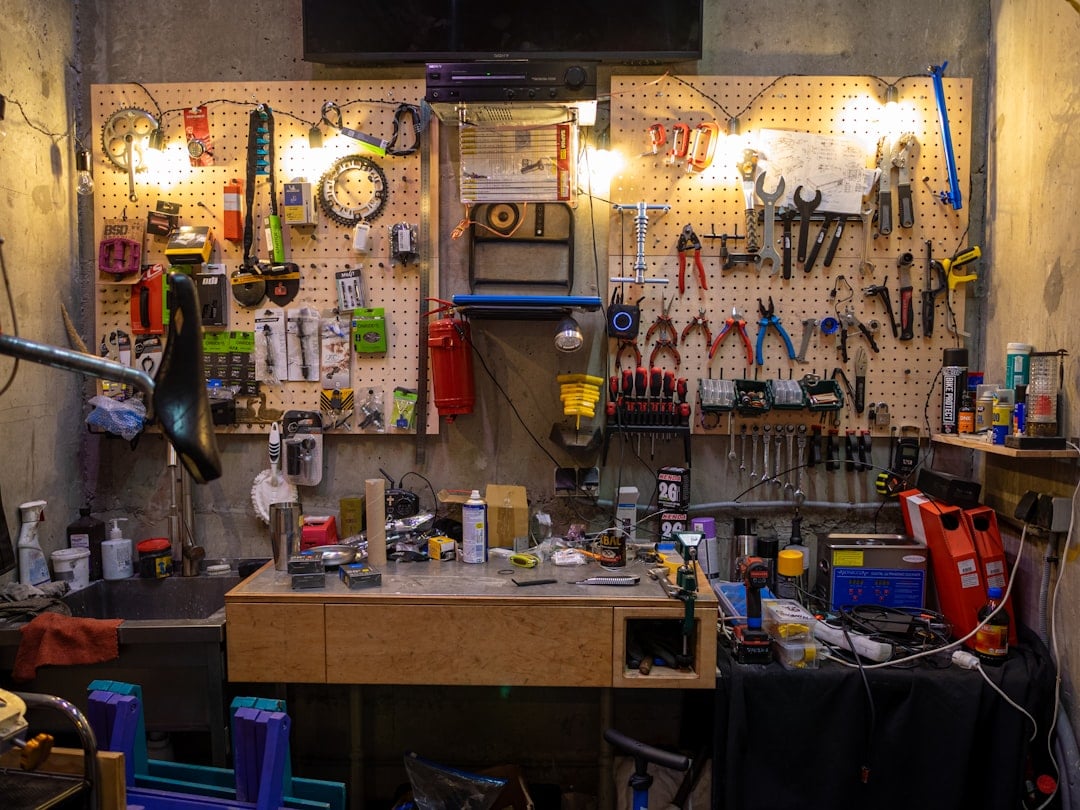 Service bench where a gym equipment parts inventory is consumed during a repair