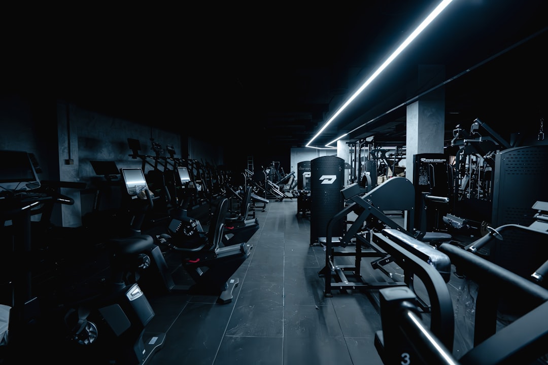 Quiet club floor where commercial stair climbers sit between peak periods